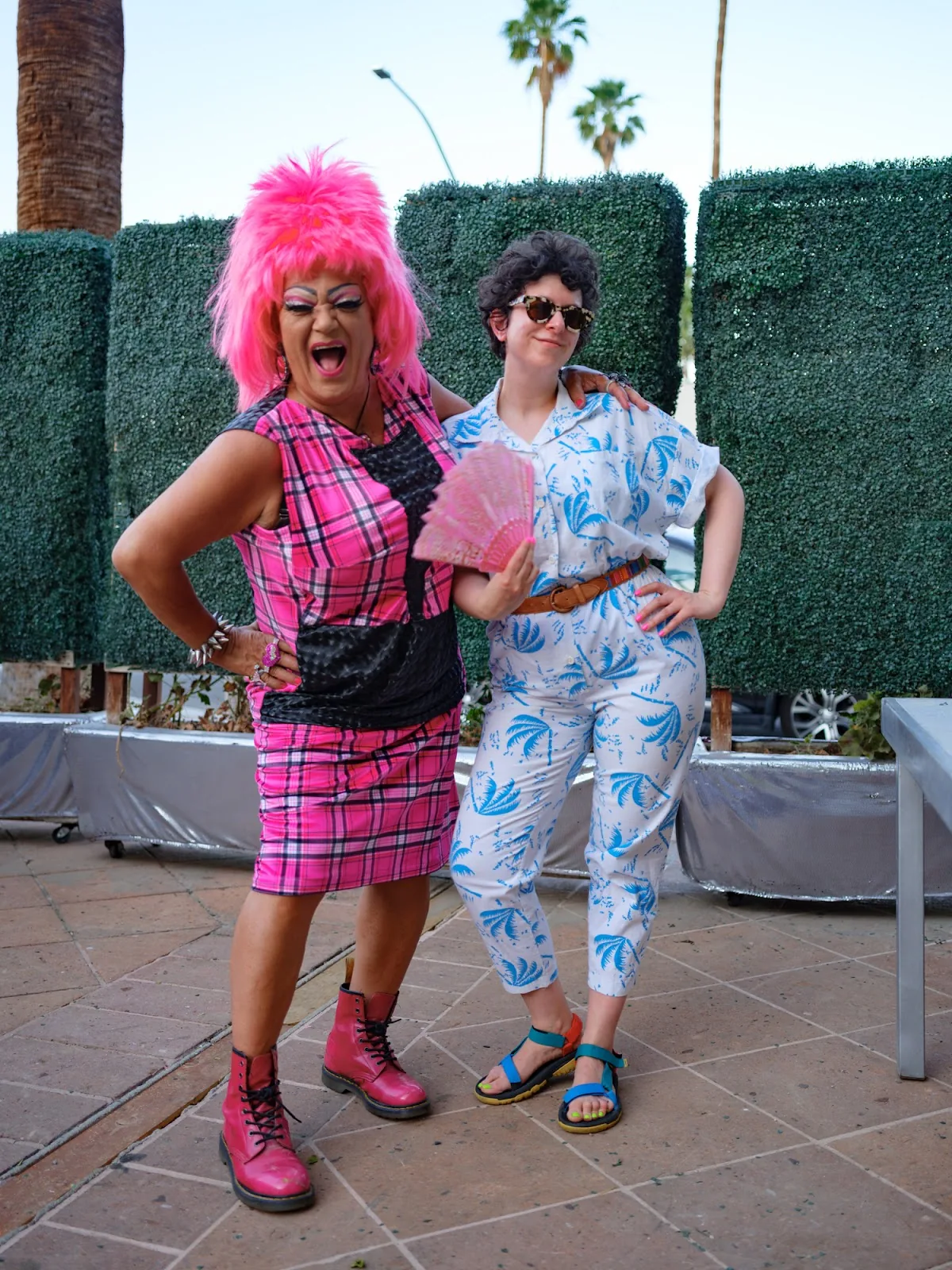 On location with Legends of Drag! Molly wears a vintage ‘80s palm-print jumpsuit (which she’s considering listing on LS) and her go-to color-blocked Tevas with Palm Spring’s finest, Mutha Chucka. Photo by Deb Leal.
