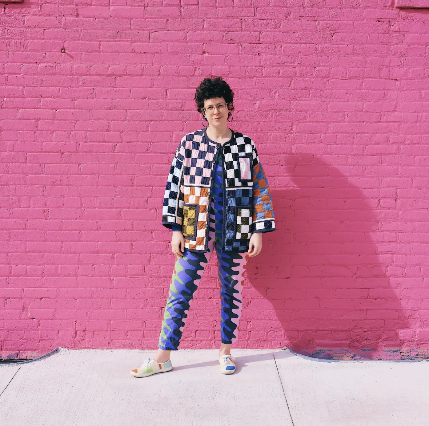 Molly wears Nooworks Overalls in Static from @NatalieM, paired with Dusen Dusen Keds and her favorite quilted jacket from Warble & Woosh. Photo by Isaac Brooks.